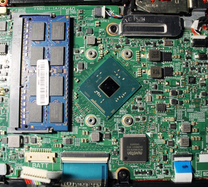 Closeup view at laptop motherboard and components. Processor and memory look like mini cities.